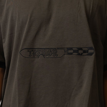 Dark gray t-shirt with 'Tremor' logo on the chest