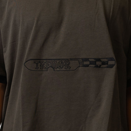 Dark gray t-shirt with 'Tremor' logo on the chest